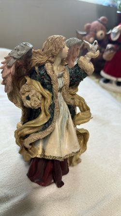 Ceramic angel Holding Bird