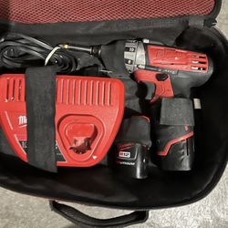 Drill Charger And 2 Batteries 