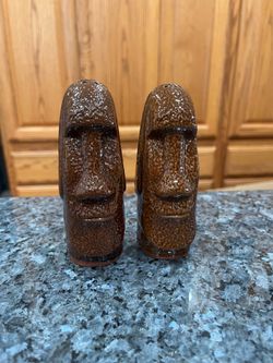 Ceramic Vintage Tiki Pair of Salt and Pepper Shakers.  Size approximately 4 1/2 inches tall.  Preowned.  Made in Japan sticker on the bottom .  Has be