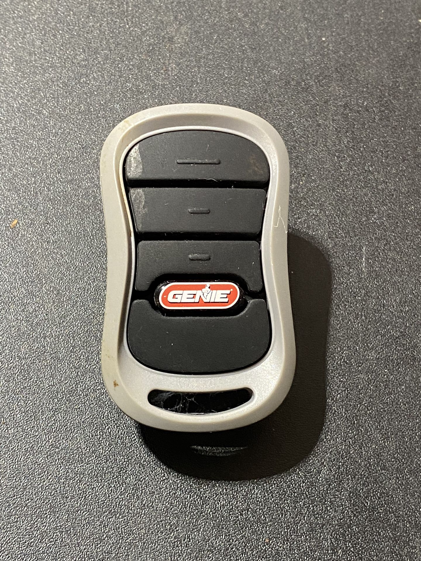 Genie Model G3T-A 3 Button Garage Door Remote Control Opener Fob W/Visor Clip. Tested and working.