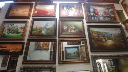 Antique frame with mirror and painting.