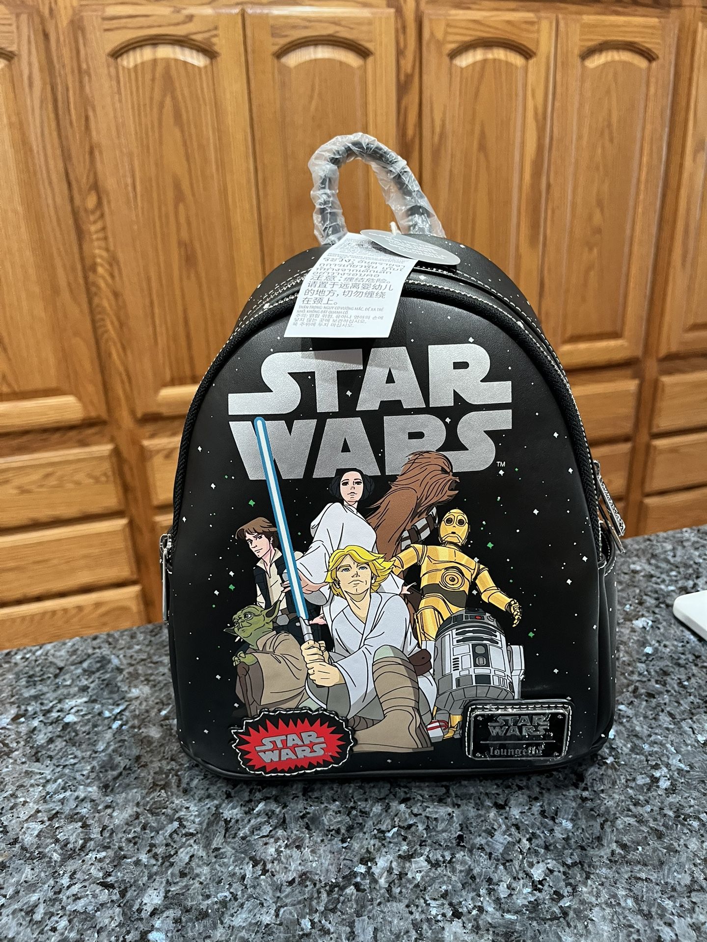 Loungefly Star Wars Glow-in-the-Dark Mini Backpack.  Brand new with tags.  Smoke free home 