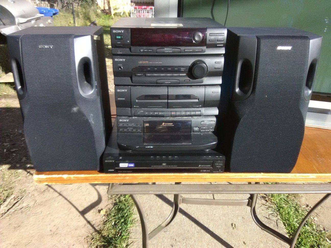 Sony 300 Watts stereo system with 5 discs DVD and CD players plus speakers