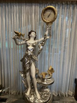 Woman With Clock Statue 