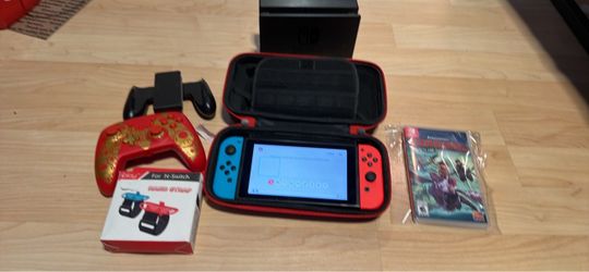Nintendo switch with docking station, charger, dragons game, case, controller, Joycon grip and hand strap no trades cash only see my other listings fo