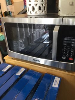 Toshiba microwave 2.1 cu ft it’s new in box Stainless steel