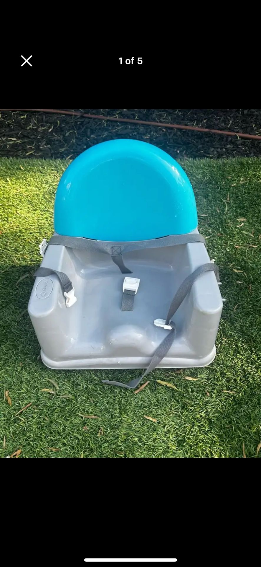 Gray Booster Seat With Blue Backrest. Trademark Brand.