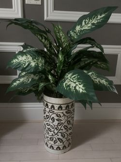 Tall round porcelain pot with silk plants