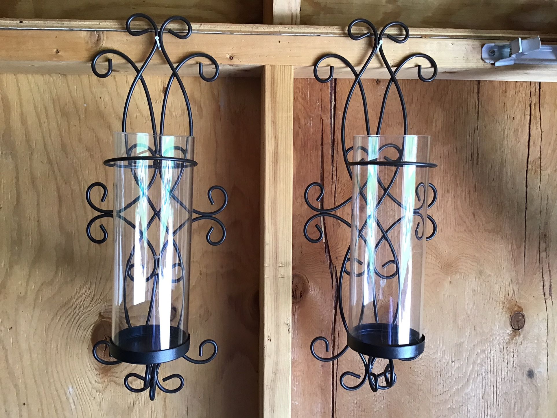 Set of two metal and glass candle holders