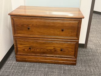 Two drawer solid wood lateral file cabinet. Locking