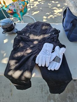 Black Snow Bib Pants with White Ski Gloves