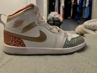 Nike kids shoe red white blue and gold