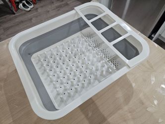 New, never used foldable dish drying rack - plastic and silicone.