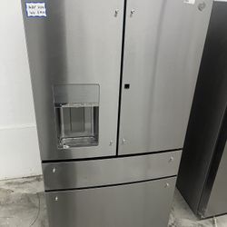 Brand new scratch/dent GE 4 door refrigerator (tested & works perfectly)