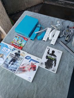 Nintendo wii Limited edition Sonic Blue. With all cables & sensors with 5 Great Games. 3 pair of controllers $200! Or trade up