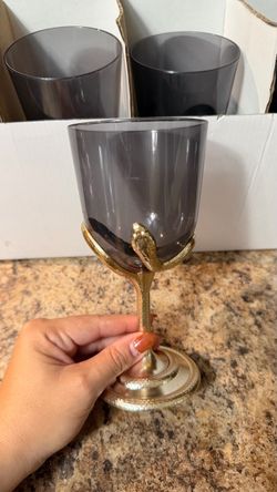 black plastic cups with a gold snake