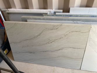 Quartz countertop 25.5”x39” long with a 1.5 inch manufactured edge on the front