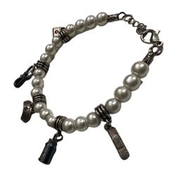 Vintage faux pearl nurse’s charm bracelet with nurse’s hat, bandaid, stethoscope, prescription bottle, and medicine bag charms