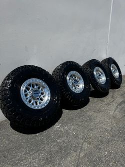 FINANCING AVAILABLE KMC KM549 GRS 8x6.5 17" Wheels Machined With 37” Toyo Open Country R/T Trail Tires