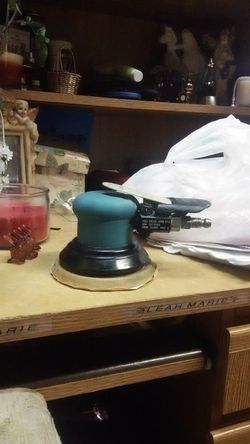 Dynabrade sander with 2 boxes sanding discs