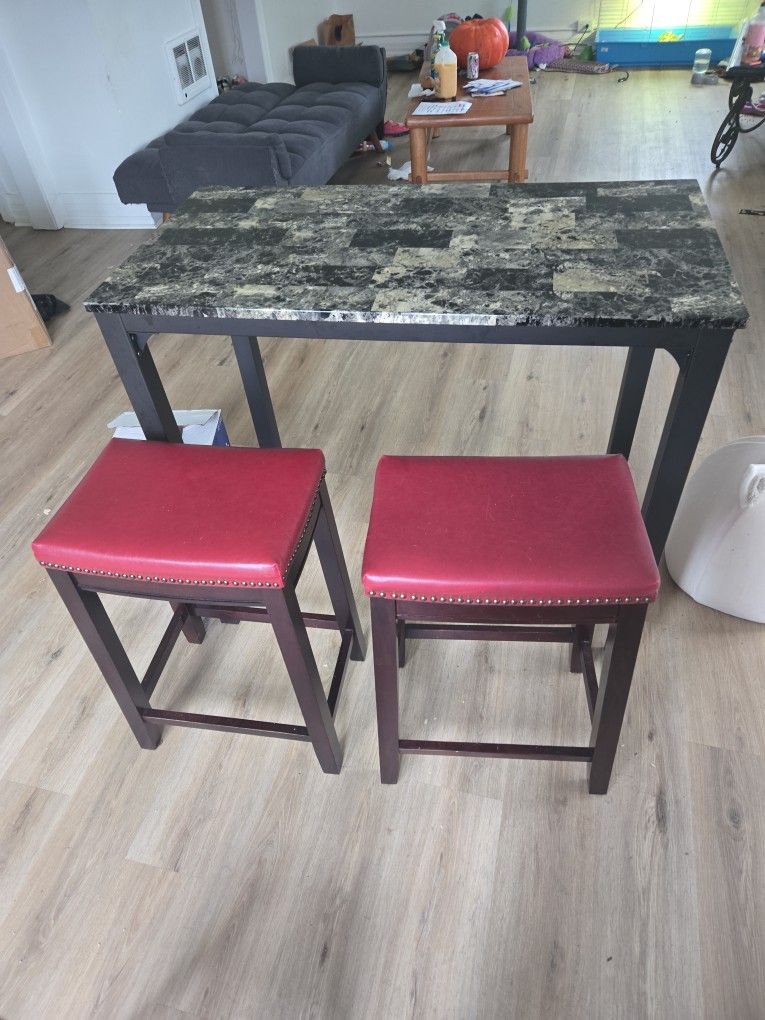 2-person marble dining table with bar stools for sale.  