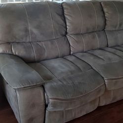 Grey couch with feet incliners