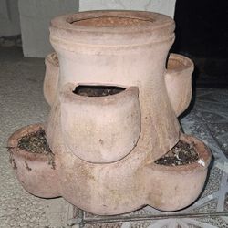 terracotta strawberry pot, a specialized planter designed with multiple side pockets for growing strawberries or herbs. 12"x12"x12"