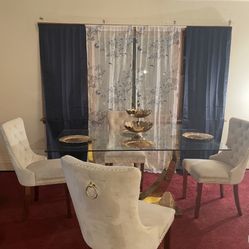 Glass dining room table includes six chairs