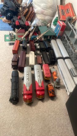 2 Complete sets of Lionel O guage trains.
