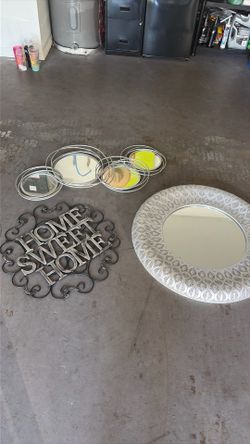Two mirrors in a home Sweet Home sign