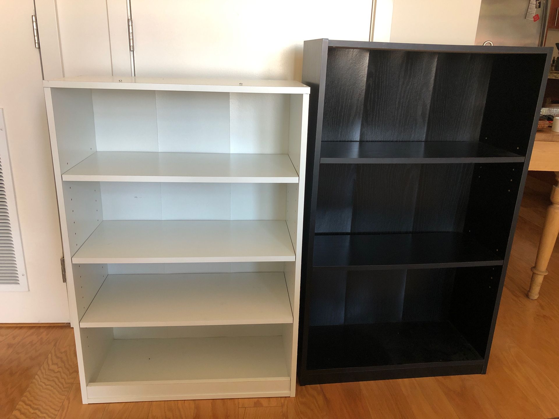 IKEA black bookshelves and white book shelf