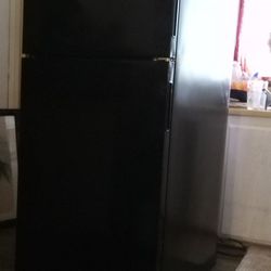  Black Maytag Refrigerator Full Size With Bright Illuminating Light In The Freezer