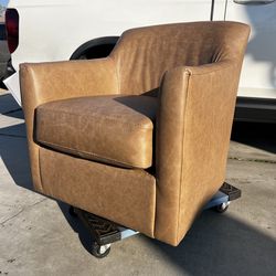 Brand New. Ashley Leather Swivel Accent Chair. Tumbleweed Color. $299 (Only 1 available)