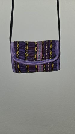 Small shoulder coin purse with a zippered pocket closure. (CODE0171)