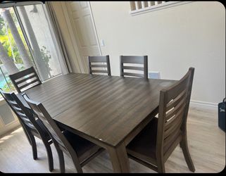 Brown Wood Dining Table with 6 Chairs – Good Condition