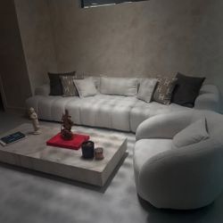 Sectional by Laura Furniture Design + Curved Chair + Artefacto Coffee Table.