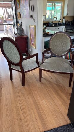 Two Wood And Teal Fabric Chairs.