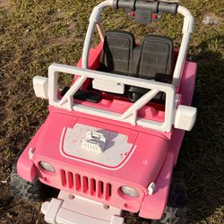 Kids ride in Jeep. 