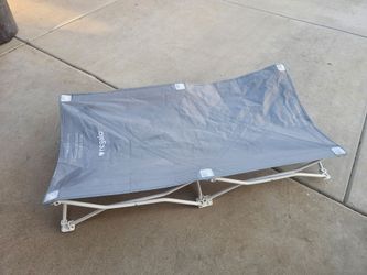 Small child cot excellent condition Used a few. Times