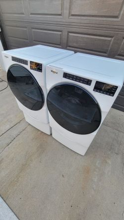 Wirpool washer and dryer with pedestals