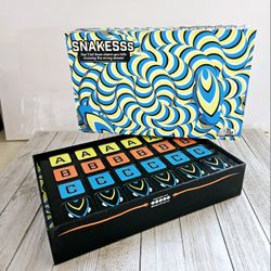 Snakesss Don't let them charm you into choosing the wrong answer Board Game by Big Potato Games. Ages 12+ 4-8 Players.

Open box, never used. Pieces a