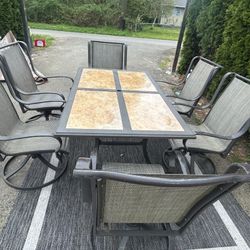 7 Piece Outdoor Table With 6 Rocking Swivel Chairs 