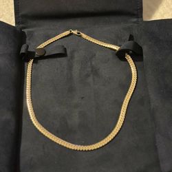 18k Yellow Gold herringbone chain with a length of 16"