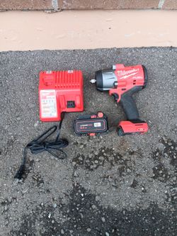 Milwaukee M18 Fuel cordless 1/2 in impact drill with bigger battery and charger works great