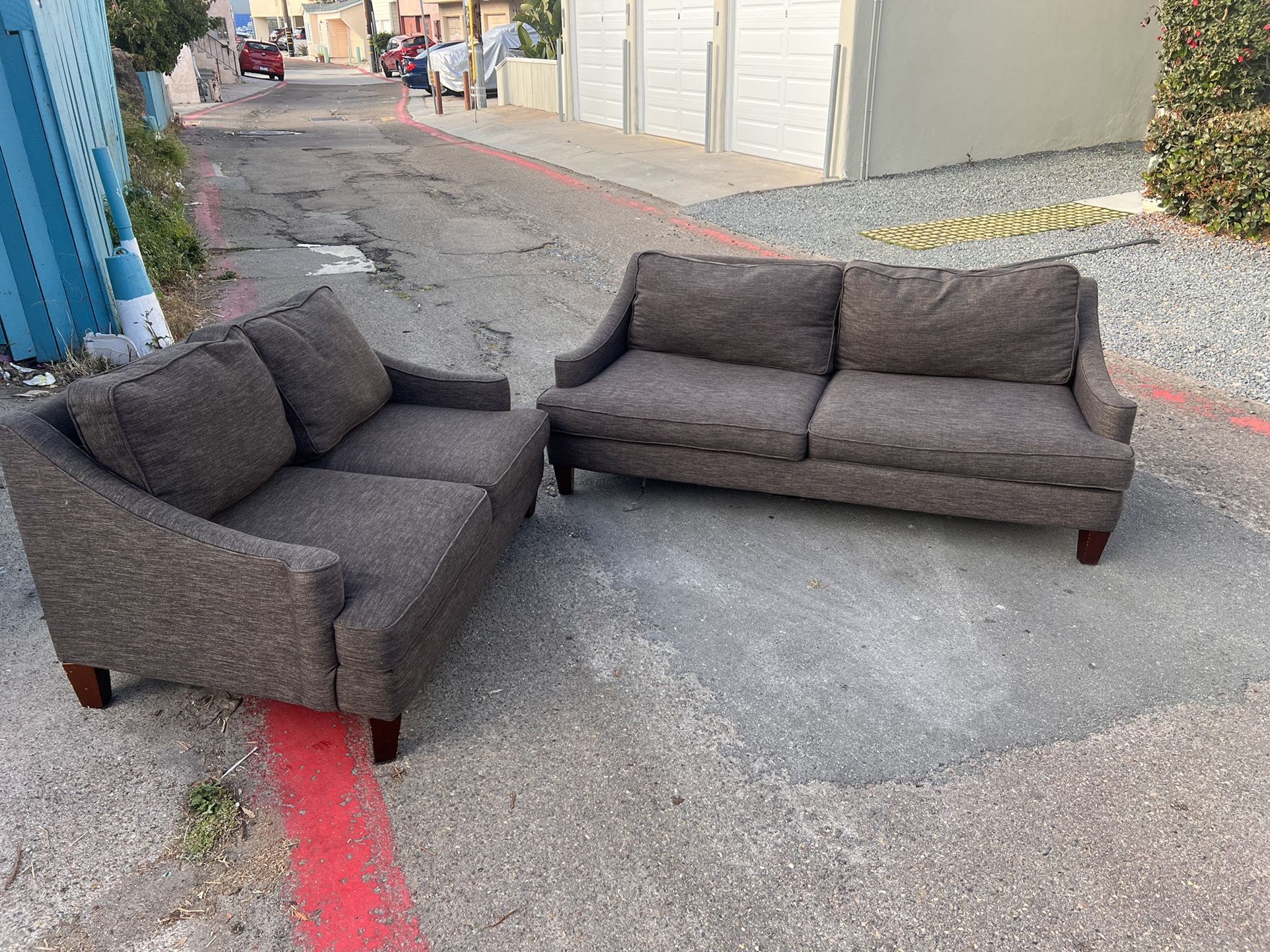 Black/Charcoal Colored Couch And Loveseat Set In Great
