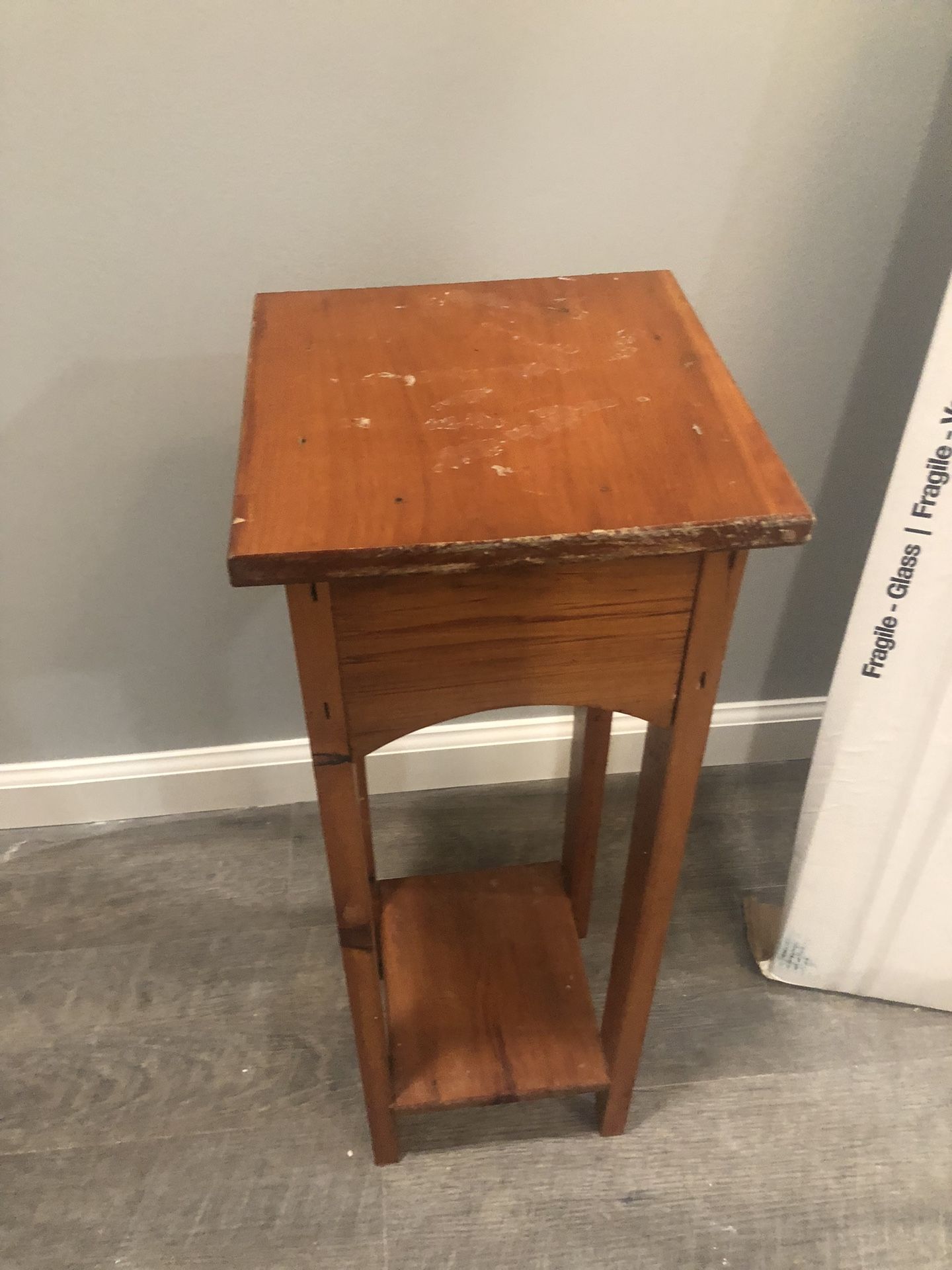 Small brown solid wood table