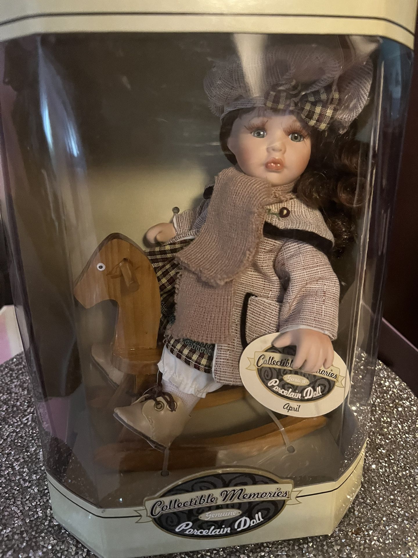 Cute Porcelain Doll On Rocking Horse