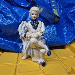 Vintage Porcelain figurine of a man dressed in Victorian