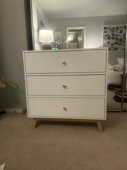 White dresser with gold knobs