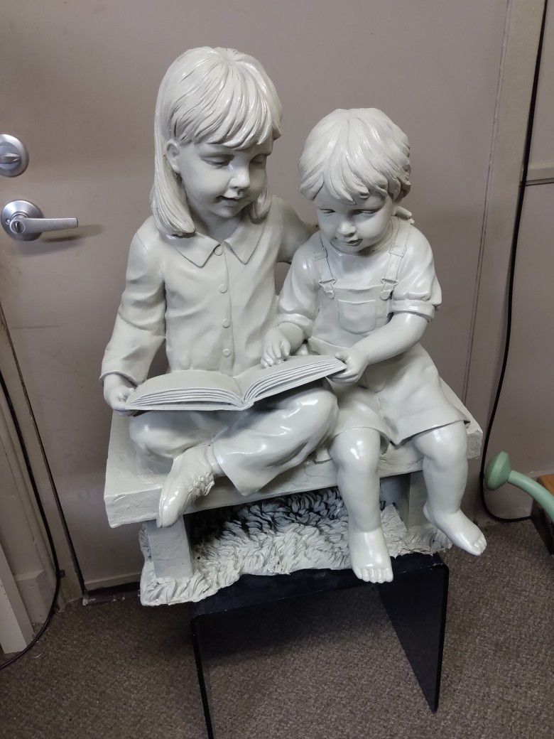 Girl And Boy Statue